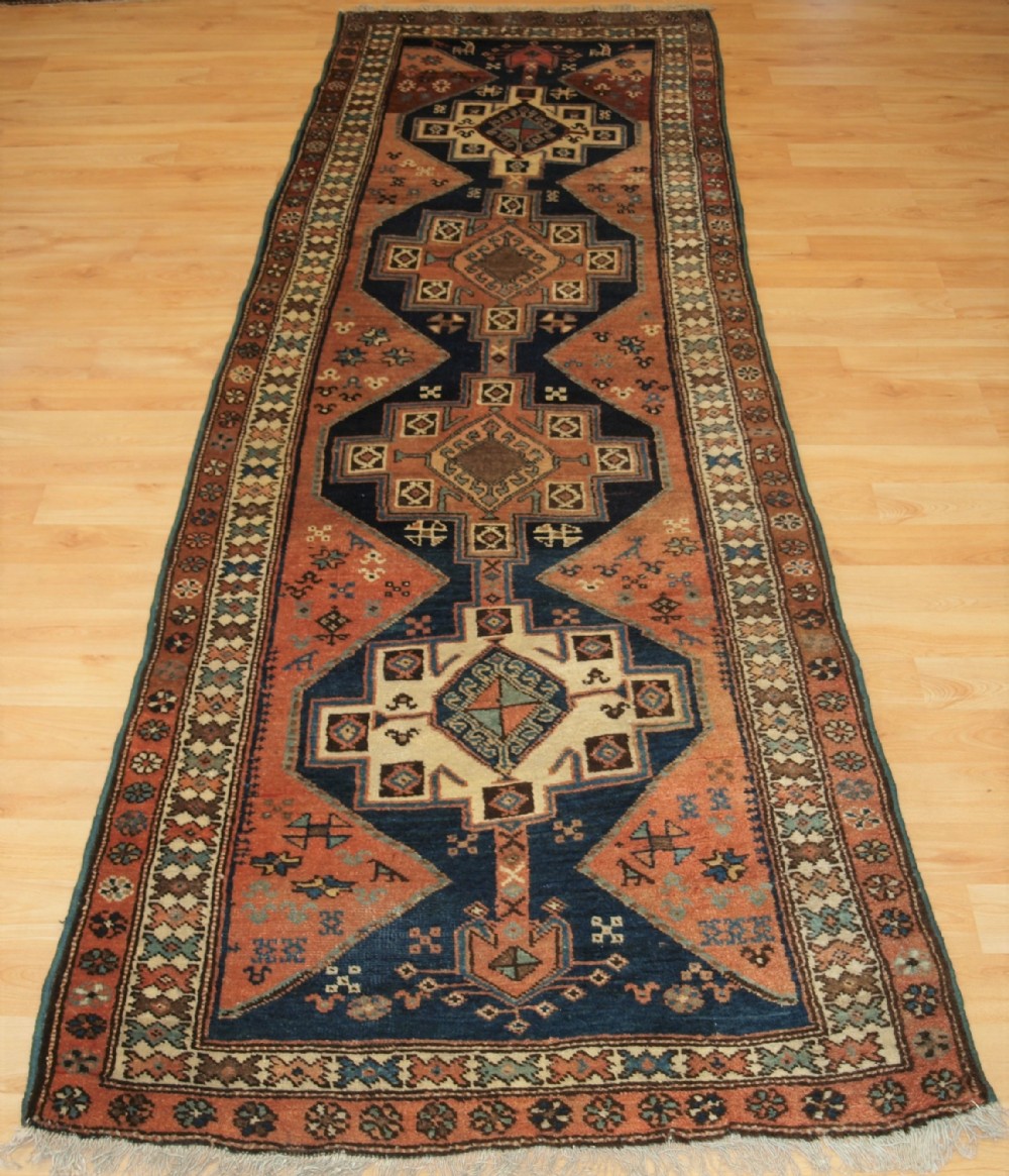 ANTIQUE KURDISH RUNNER WITH RUSTIC CHARM, CIRCA 1900.