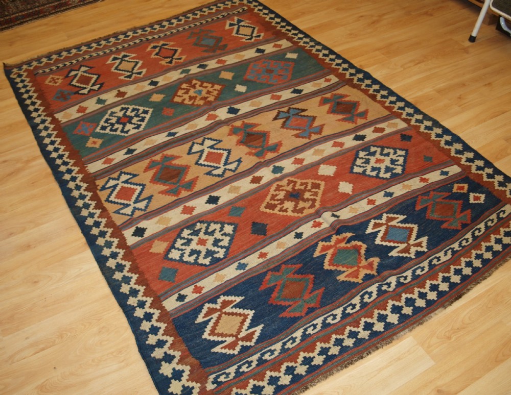 ANTIQUE QASHQAI TRIBAL KILIM WITH BANDED DESIGN, CIRCA 1900. View II