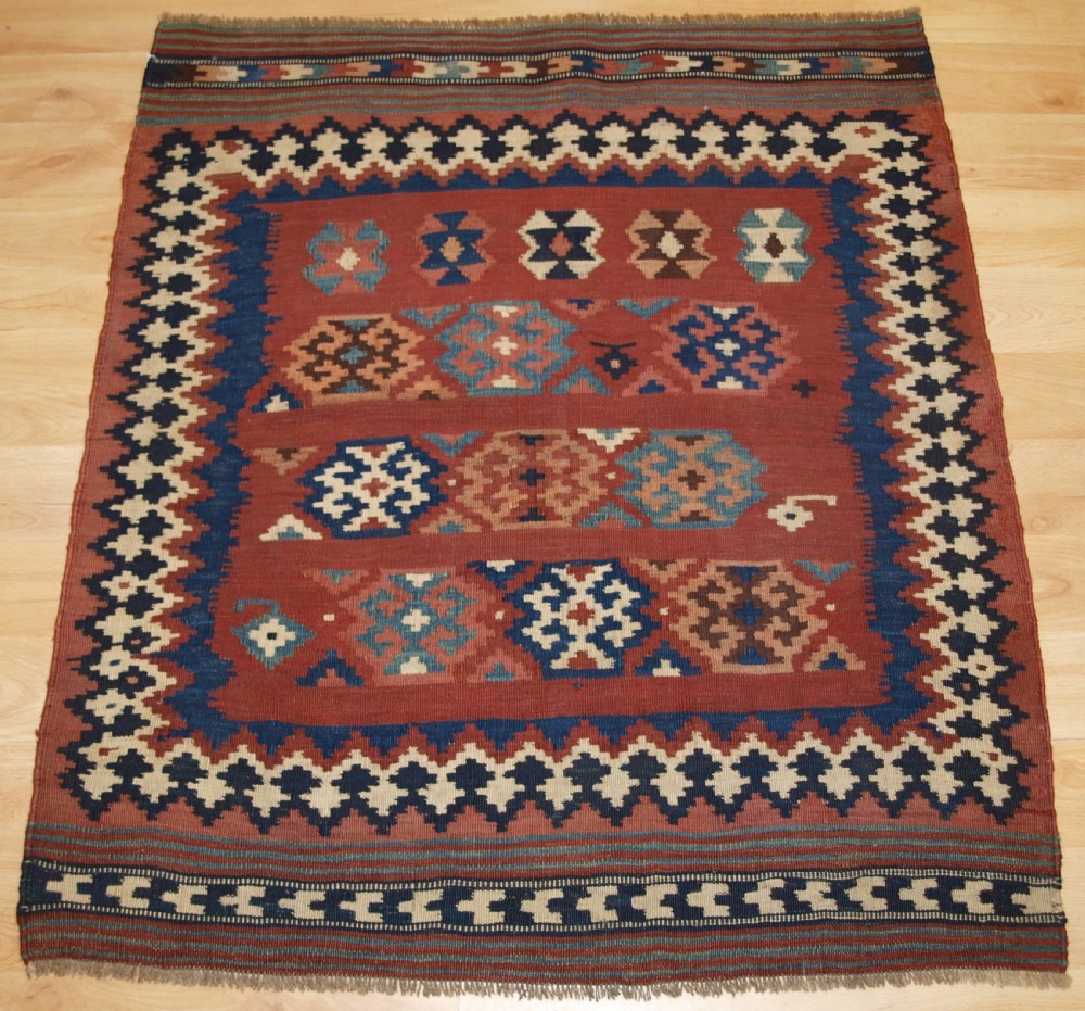 ANTIQUE TRIBAL QASHQAI KILIM SOFREH, EATING CLOTH, CIRCA 1900.