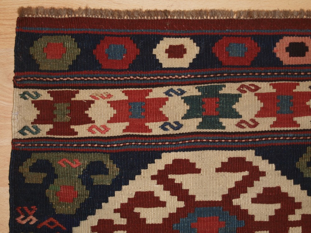 ANTIQUE SOUTH EAST CAUCASIAN OR SHAHSAVAN MAFRASH END PANEL, CIRCA 1900. View II