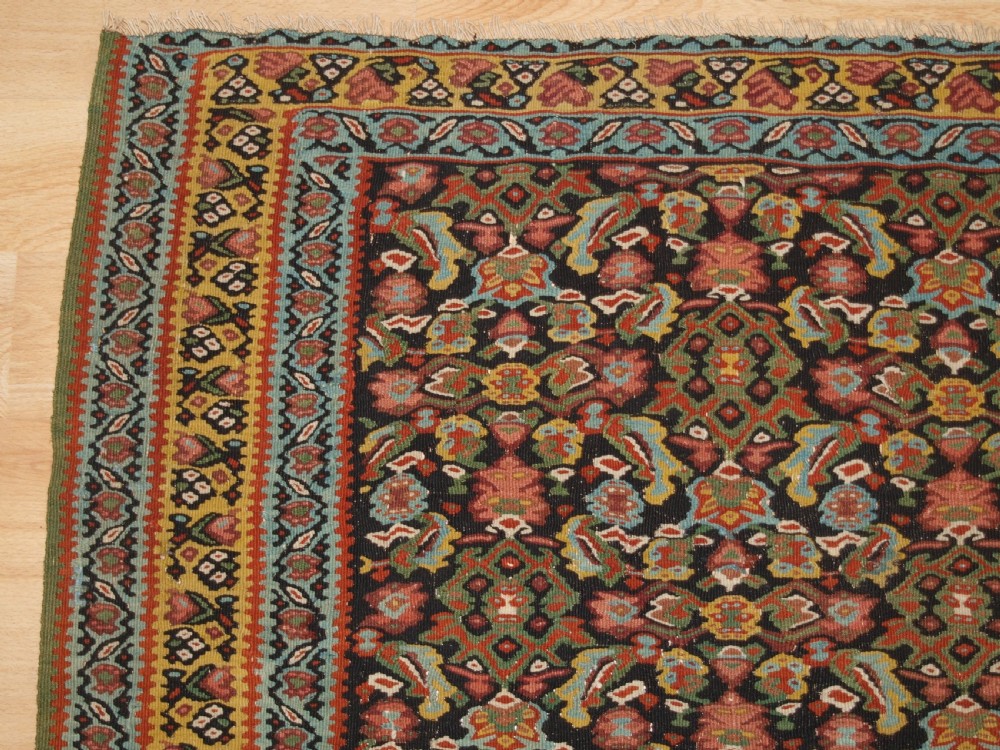 ANTIQUE SENNEH KILIM, SINGLE MEDALLION WITH HERATI, CIRCA 1900. View III
