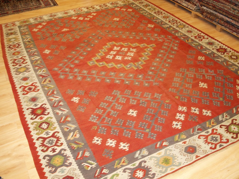 ANTIQUE SHARKOY KILIM, TRADITIONAL DESIGN AND SOFT COLOURS, CIRCA 1920.