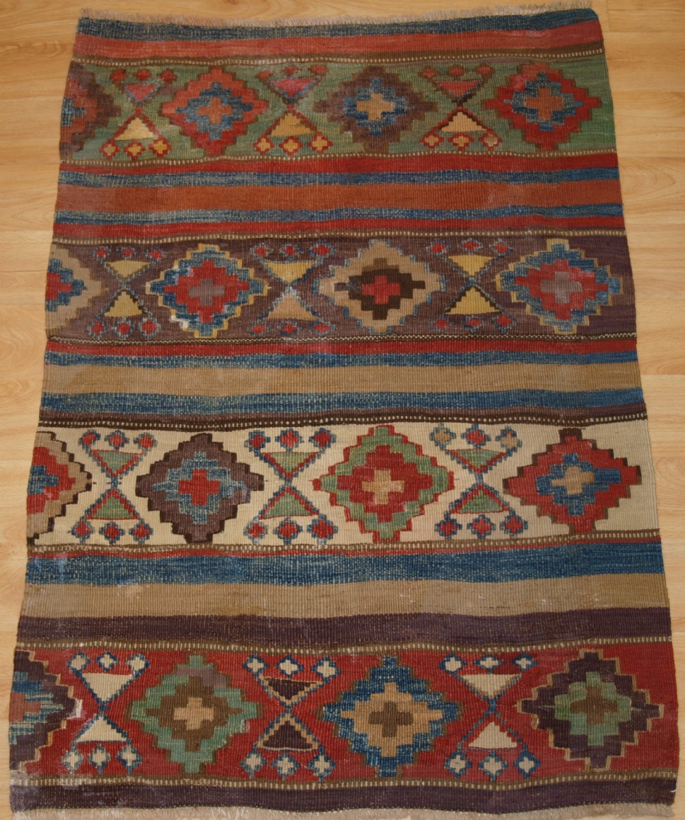 ANTIQUE CAUCASIAN OR SHAHSAVAN KILIM OF SMALL SIZE, CIRCA 1900.