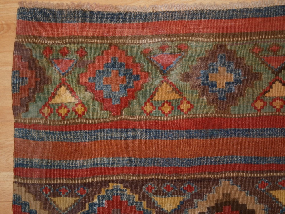 ANTIQUE CAUCASIAN OR SHAHSAVAN KILIM OF SMALL SIZE, CIRCA 1900. View III