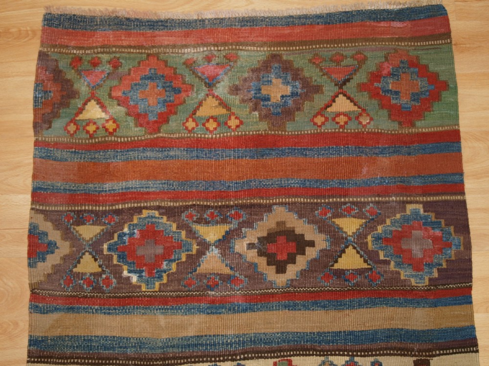 ANTIQUE CAUCASIAN OR SHAHSAVAN KILIM OF SMALL SIZE, CIRCA 1900. View IV
