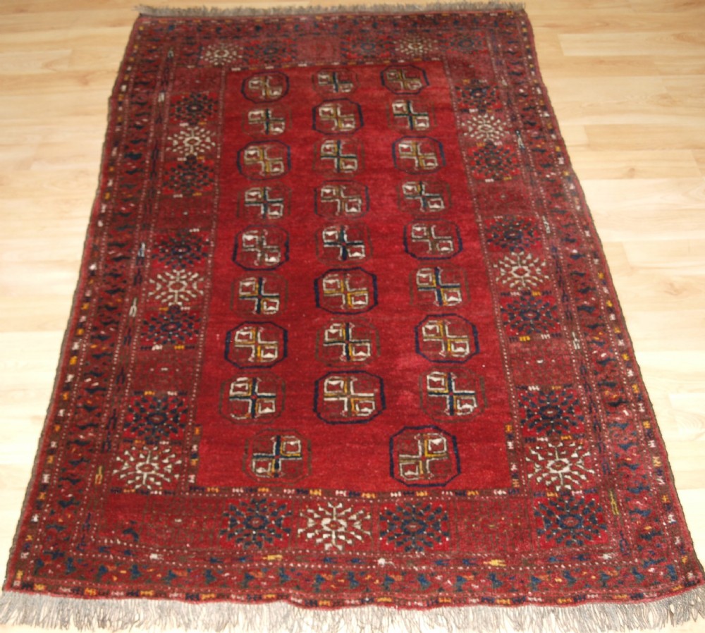 OLD AFGHAN VILLAGE RUG WITH TURKMEN DESIGN, CIRCA 1930.