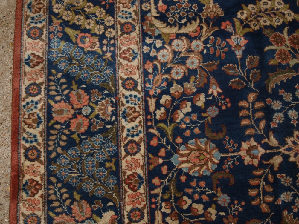 OLD TABRIZ CARPET WITH LARGE SCALE FLORAL DESIGN, CIRCA 1920. View IV