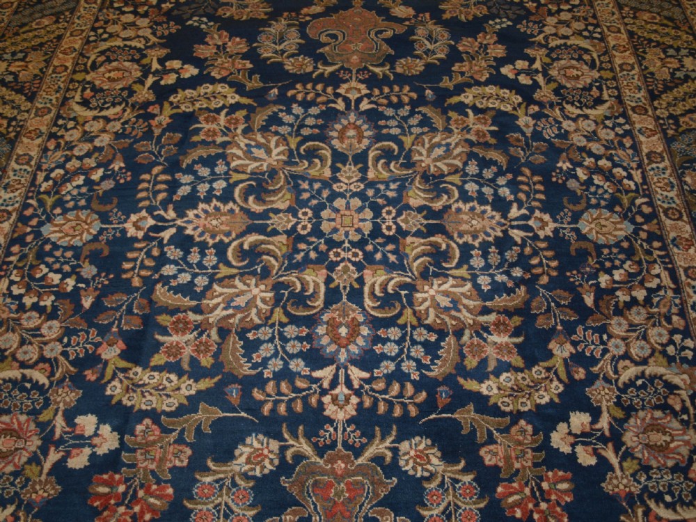OLD TABRIZ CARPET WITH LARGE SCALE FLORAL DESIGN, CIRCA 1920. View VI