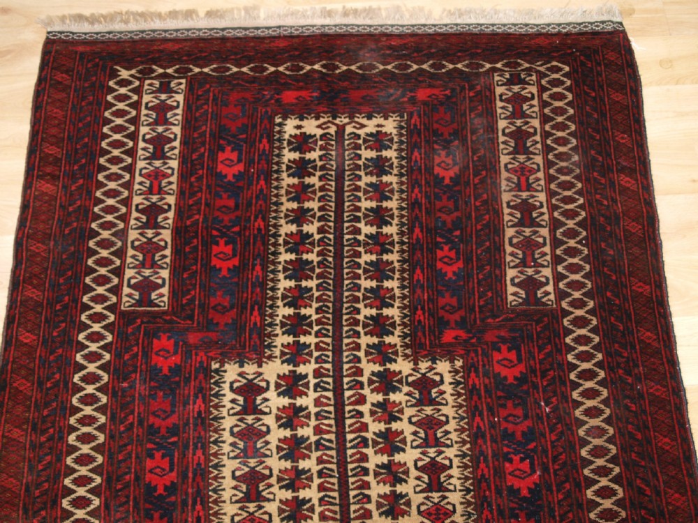 OLD BALUCH CAMEL GROUND PRAYER RUG WITH TREE OF LIFE, CIRCA 1920. View V