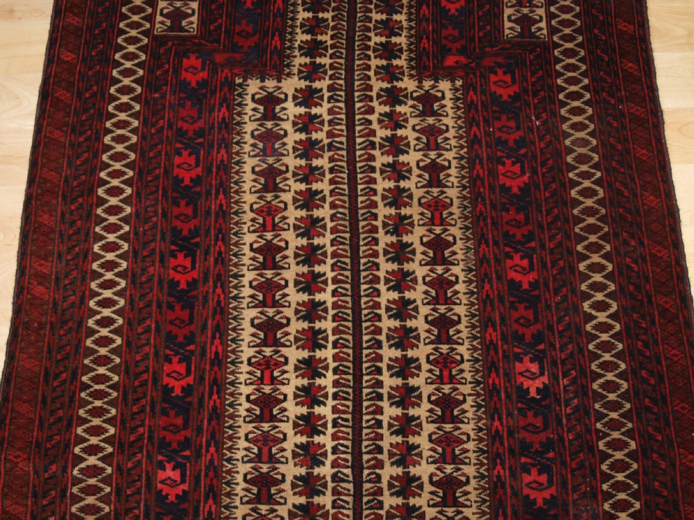 OLD BALUCH CAMEL GROUND PRAYER RUG WITH TREE OF LIFE, CIRCA 1920. View VI