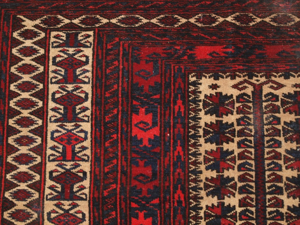 OLD BALUCH CAMEL GROUND PRAYER RUG WITH TREE OF LIFE, CIRCA 1920. View VIII