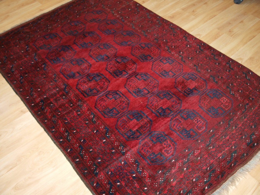 OLD AFGHAN VILLAGE RUG OF TRADITIONAL DESIGN, GOOD COLOUR, CIRCA 1920. View II