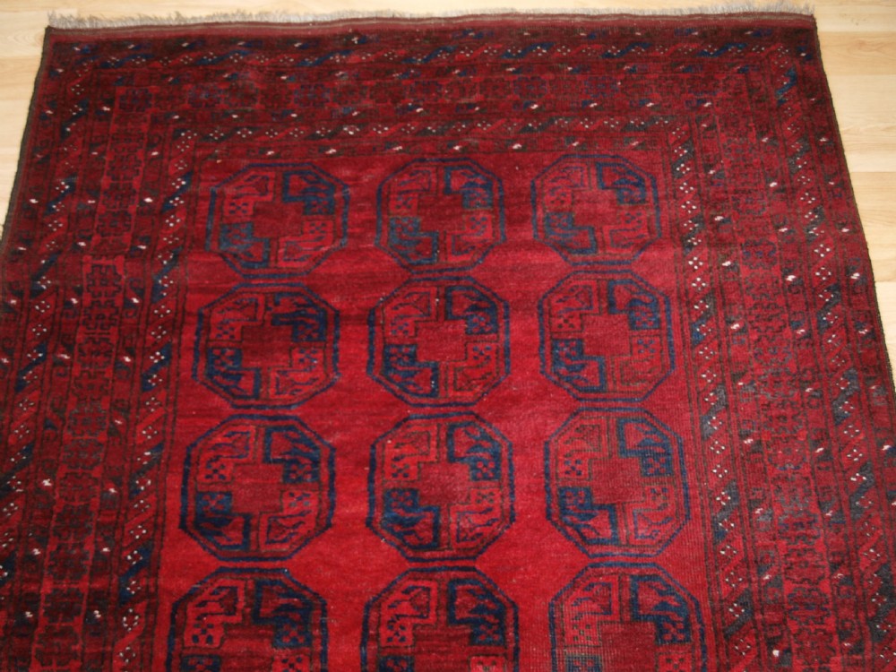 OLD AFGHAN VILLAGE RUG OF TRADITIONAL DESIGN, GOOD COLOUR, CIRCA 1920. View IV