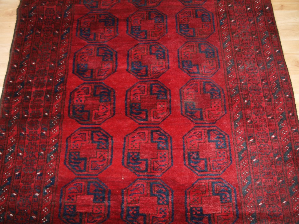 OLD AFGHAN VILLAGE RUG OF TRADITIONAL DESIGN, GOOD COLOUR, CIRCA 1920. View V