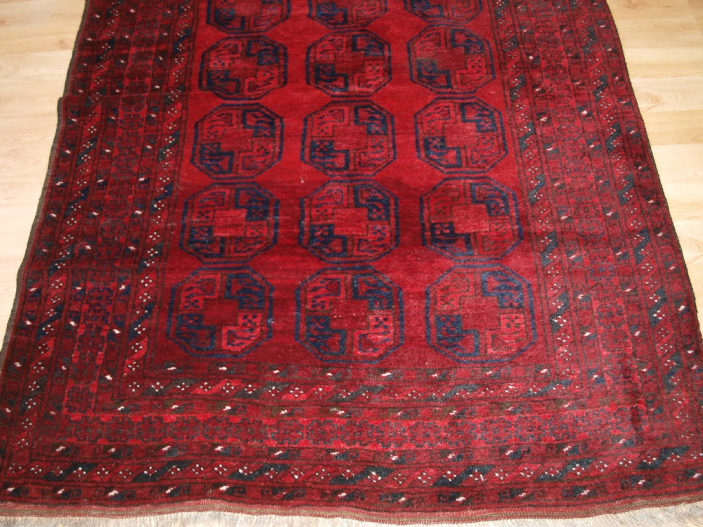 OLD AFGHAN VILLAGE RUG OF TRADITIONAL DESIGN, GOOD COLOUR, CIRCA 1920. View VI