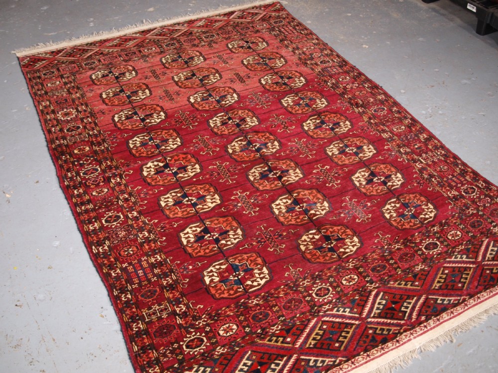 ANTIQUE TEKKE TURKMEN RUG, SOFT MADDER RED COLOUR, CIRCA 1900. View II
