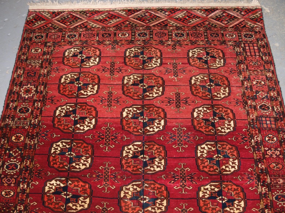 ANTIQUE TEKKE TURKMEN RUG, SOFT MADDER RED COLOUR, CIRCA 1900. View III