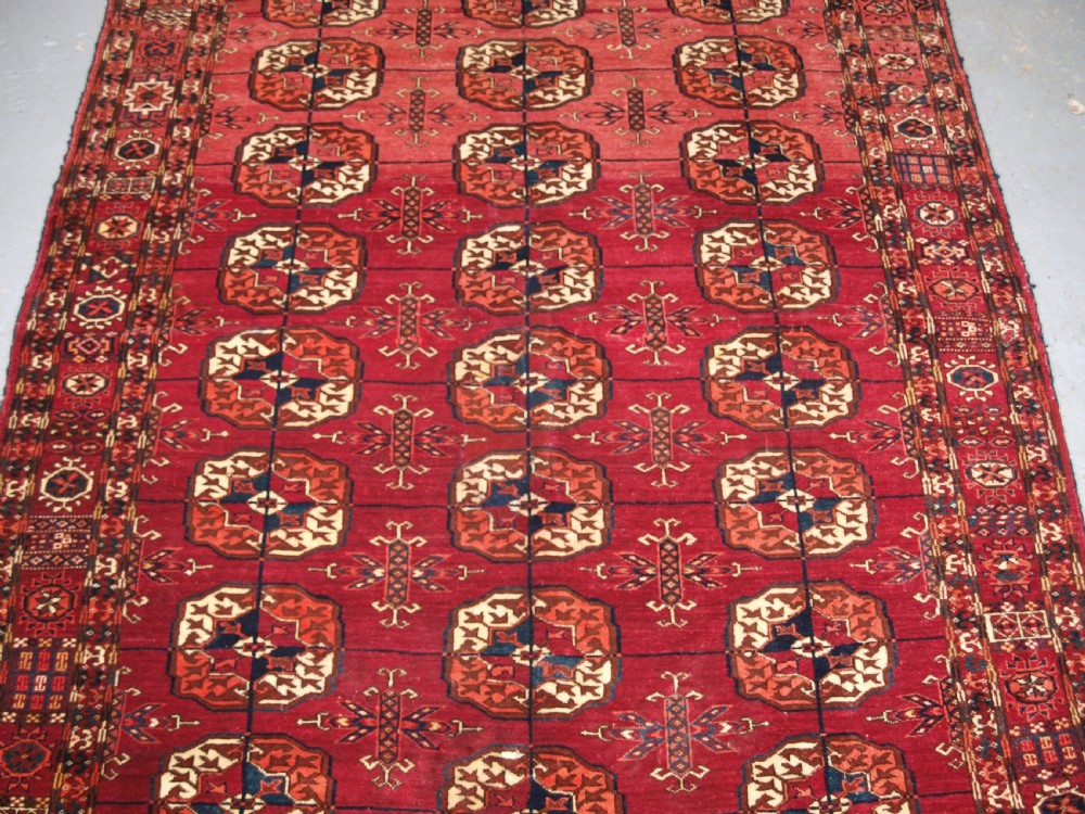 ANTIQUE TEKKE TURKMEN RUG, SOFT MADDER RED COLOUR, CIRCA 1900. View IV