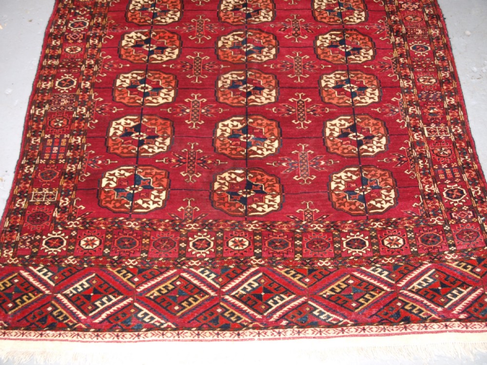 ANTIQUE TEKKE TURKMEN RUG, SOFT MADDER RED COLOUR, CIRCA 1900. View V