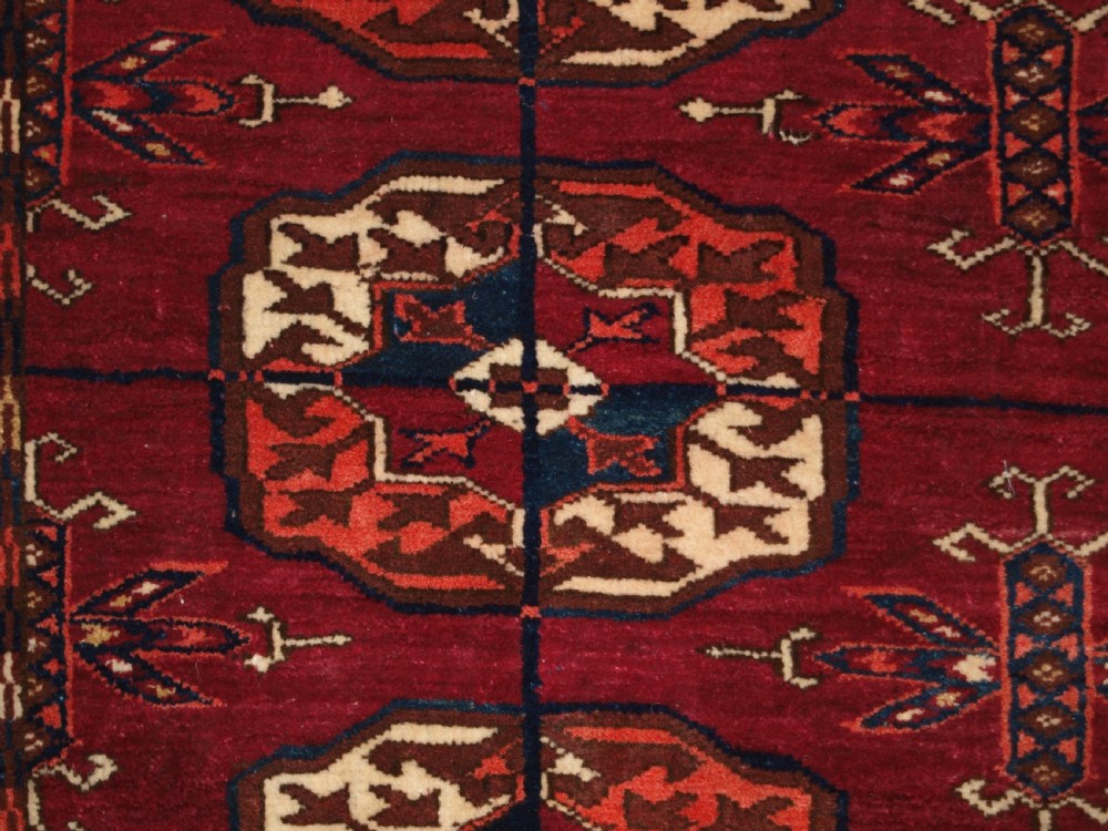 ANTIQUE TEKKE TURKMEN RUG, SOFT MADDER RED COLOUR, CIRCA 1900. View IX