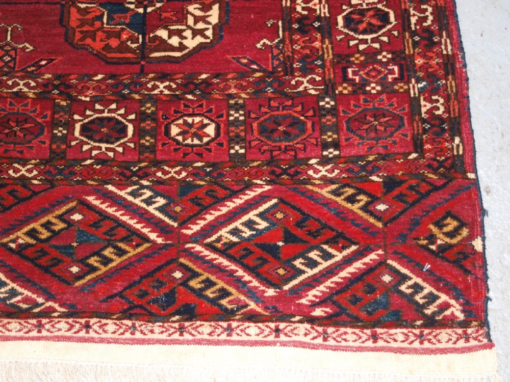 ANTIQUE TEKKE TURKMEN RUG, SOFT MADDER RED COLOUR, CIRCA 1900. View X