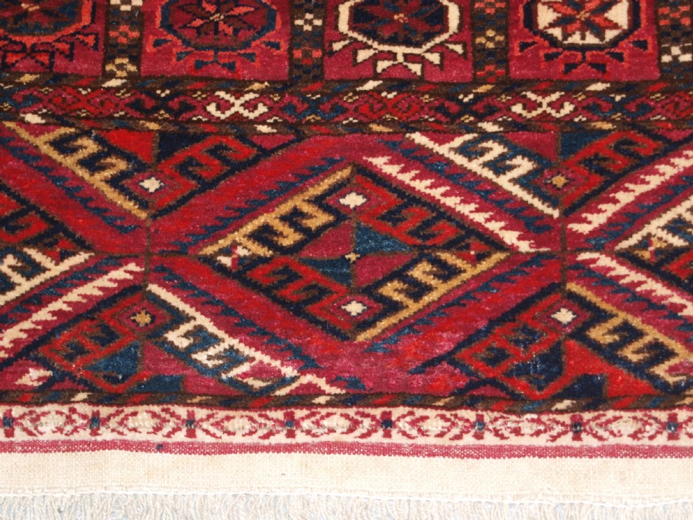ANTIQUE TEKKE TURKMEN RUG, SOFT MADDER RED COLOUR, CIRCA 1900. View XI