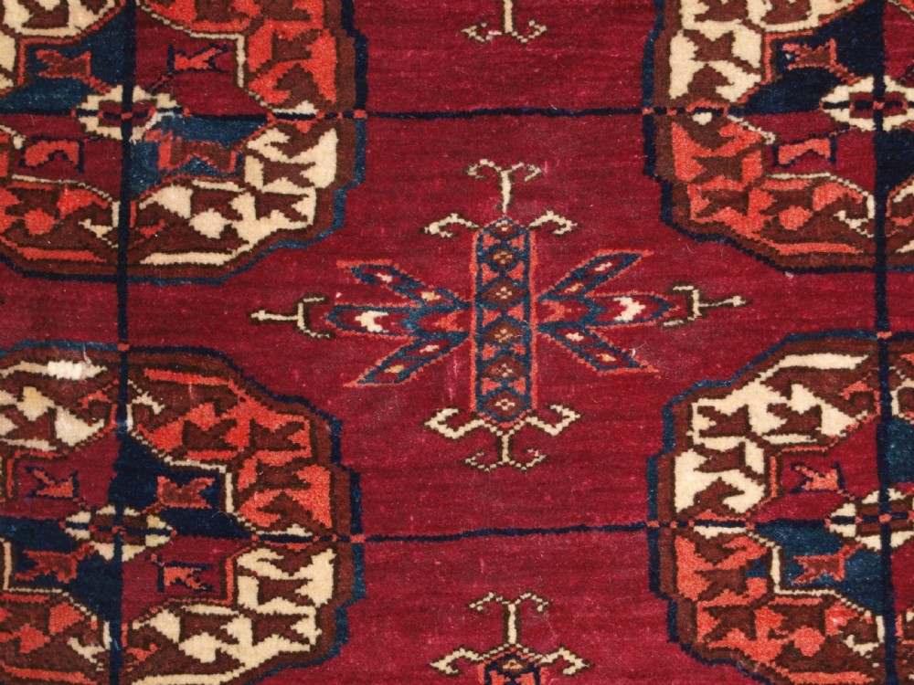 ANTIQUE TEKKE TURKMEN RUG, SOFT MADDER RED COLOUR, CIRCA 1900. View XII
