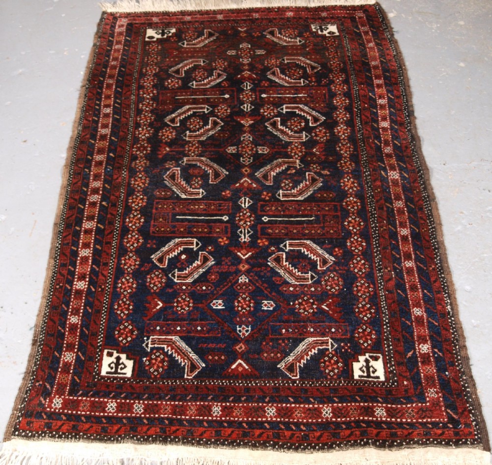 ANTIQUE BALUCH RUG, SALAR KHANI SUB TRIBE, HERATI DESIGN, CIRCA 1900.