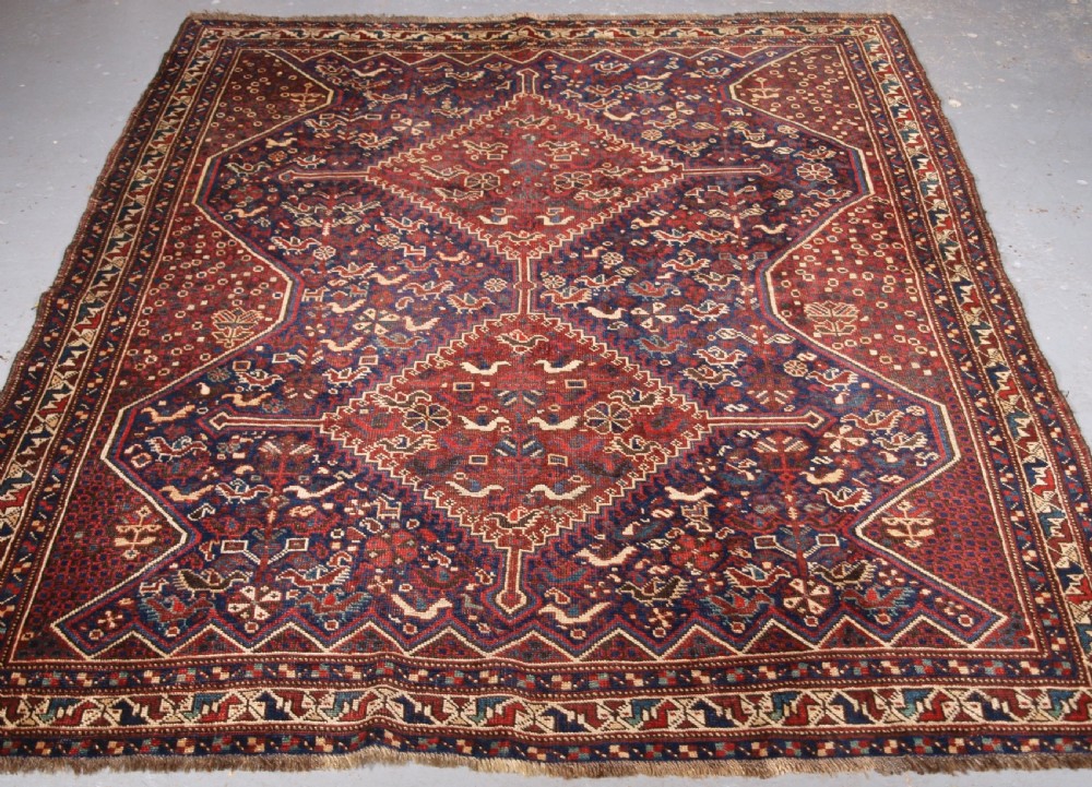 ANTIQUE KHAMSEH RUG WITH ALL OVER CHICKEN DESIGN, CIRCA 1900/20.