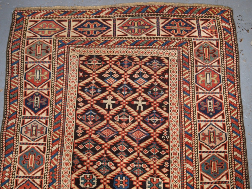 ANTIQUE CAUCASIAN DAGESTAN RUG, LATTICE DESIGN WITH HUMAN FIGURES, CIRCA 1880. View III