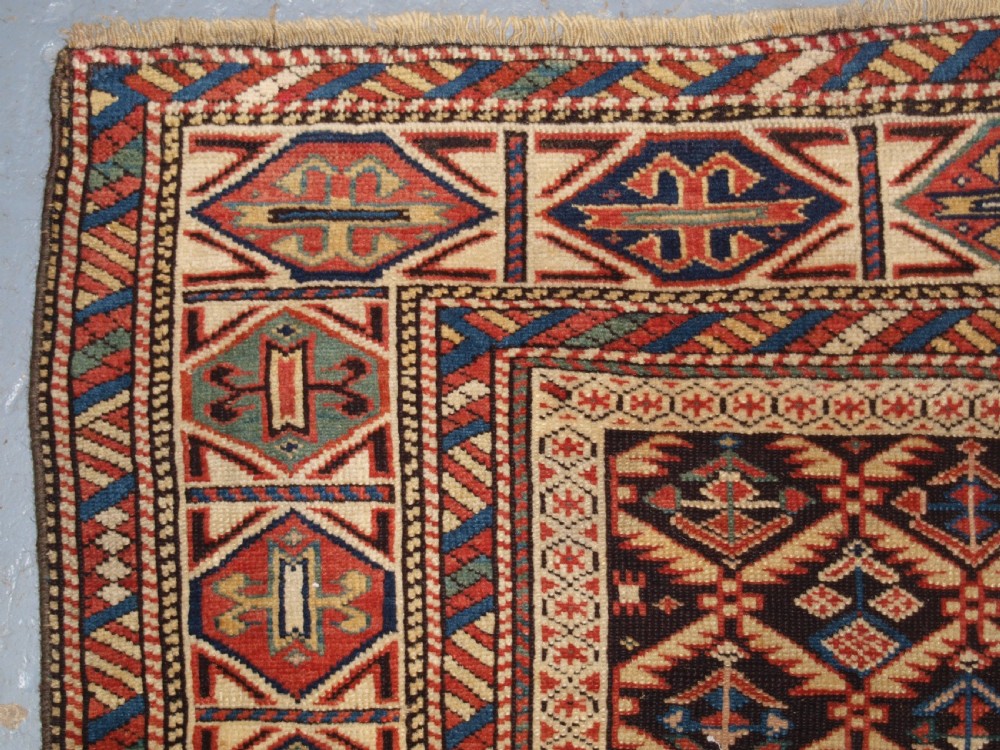 ANTIQUE CAUCASIAN DAGESTAN RUG, LATTICE DESIGN WITH HUMAN FIGURES, CIRCA 1880. View VI