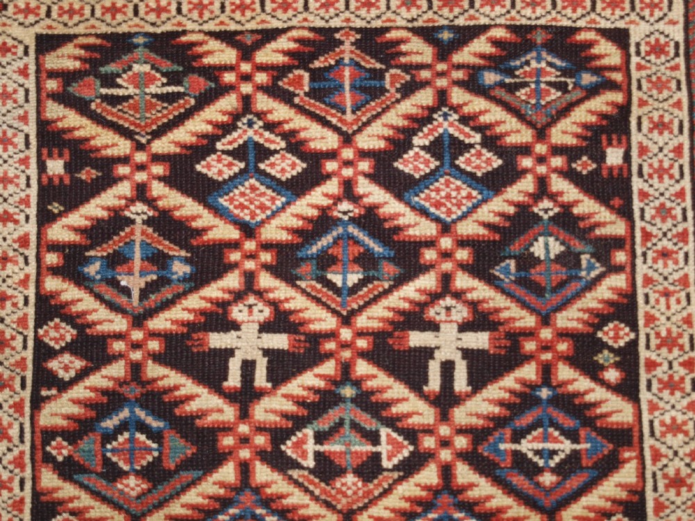 ANTIQUE CAUCASIAN DAGESTAN RUG, LATTICE DESIGN WITH HUMAN FIGURES, CIRCA 1880. View VIII