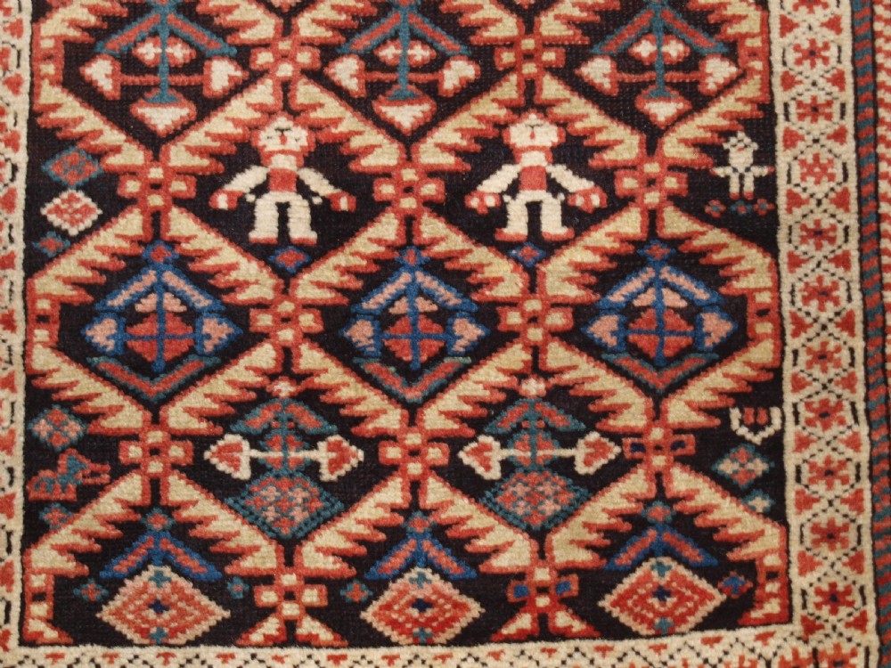ANTIQUE CAUCASIAN DAGESTAN RUG, LATTICE DESIGN WITH HUMAN FIGURES, CIRCA 1880. View IX