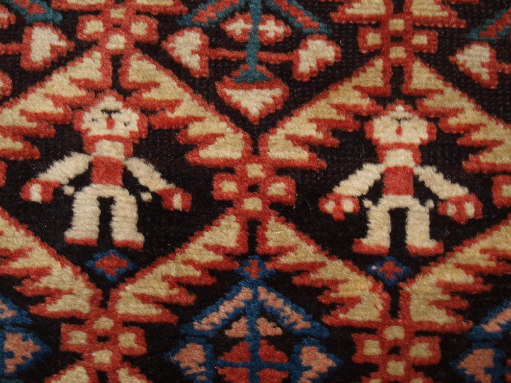 ANTIQUE CAUCASIAN DAGESTAN RUG, LATTICE DESIGN WITH HUMAN FIGURES, CIRCA 1880. View XI