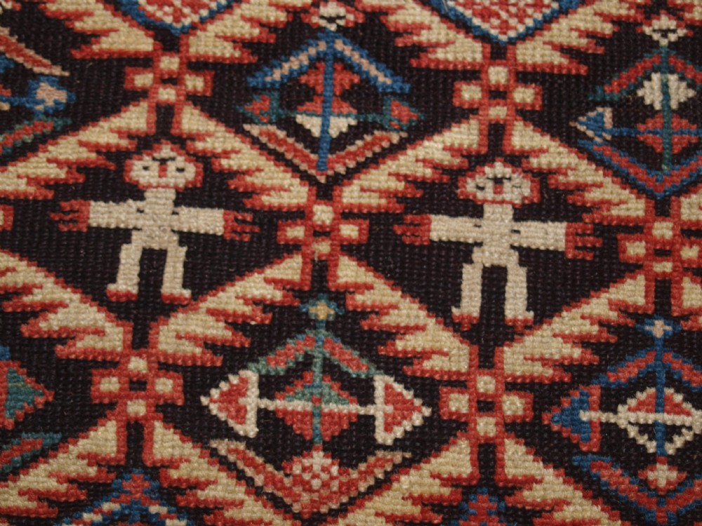 ANTIQUE CAUCASIAN DAGESTAN RUG, LATTICE DESIGN WITH HUMAN FIGURES, CIRCA 1880. View XII