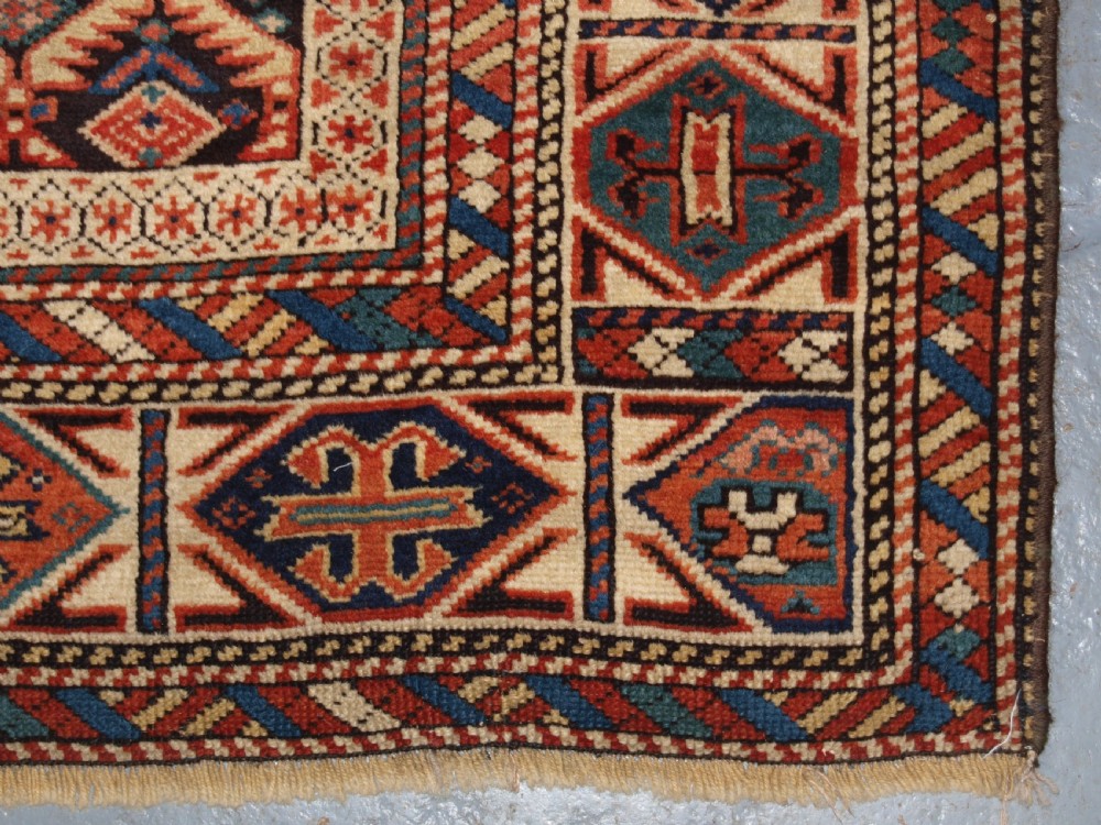 ANTIQUE CAUCASIAN DAGESTAN RUG, LATTICE DESIGN WITH HUMAN FIGURES, CIRCA 1880. View XIII