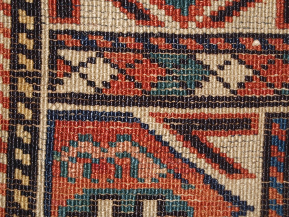 ANTIQUE CAUCASIAN DAGESTAN RUG, LATTICE DESIGN WITH HUMAN FIGURES, CIRCA 1880. View XIV
