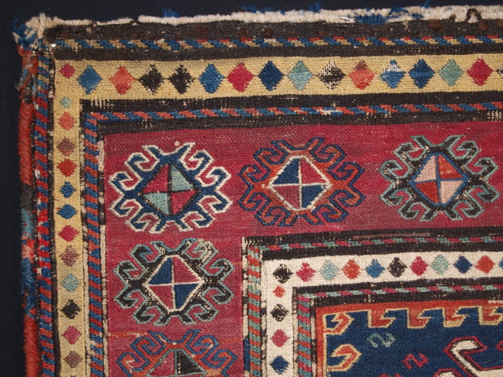 ANTIQUE SOUTH CAUCASIAN KHORJIN SADDLEBAG IN SOUMAK WEAVE, CIRCA 1900. A. View II