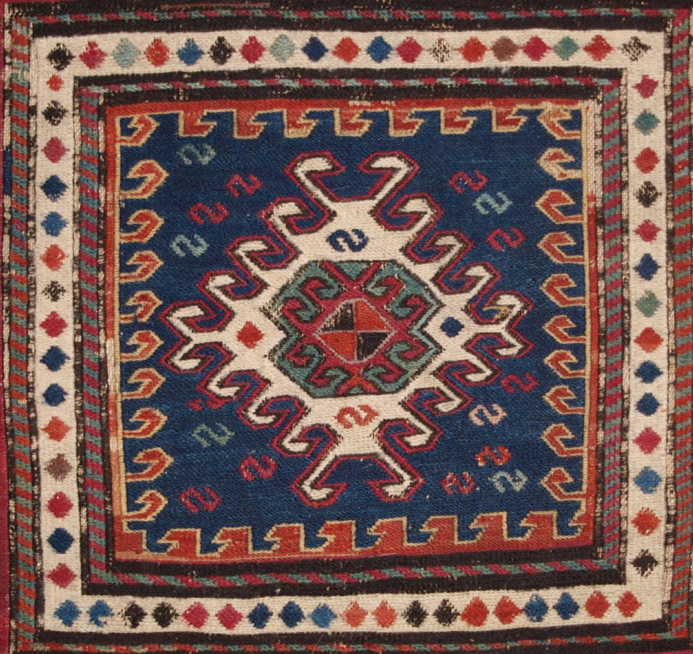 ANTIQUE SOUTH CAUCASIAN KHORJIN SADDLEBAG IN SOUMAK WEAVE, CIRCA 1900. A. View III
