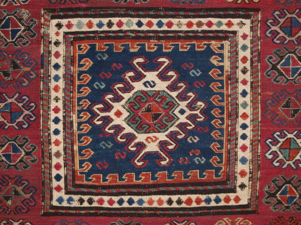 ANTIQUE SOUTH CAUCASIAN KHORJIN SADDLEBAG IN SOUMAK WEAVE, CIRCA 1900. A. View IV
