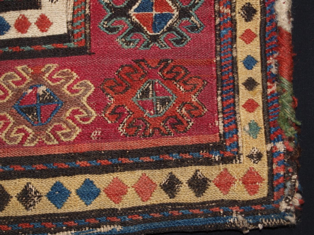ANTIQUE SOUTH CAUCASIAN KHORJIN SADDLEBAG IN SOUMAK WEAVE, CIRCA 1900. A. View VI