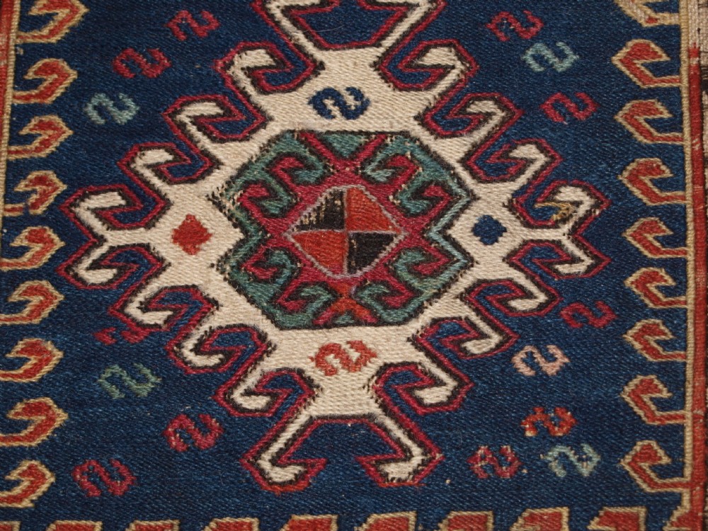 ANTIQUE SOUTH CAUCASIAN KHORJIN SADDLEBAG IN SOUMAK WEAVE, CIRCA 1900. A. View VII