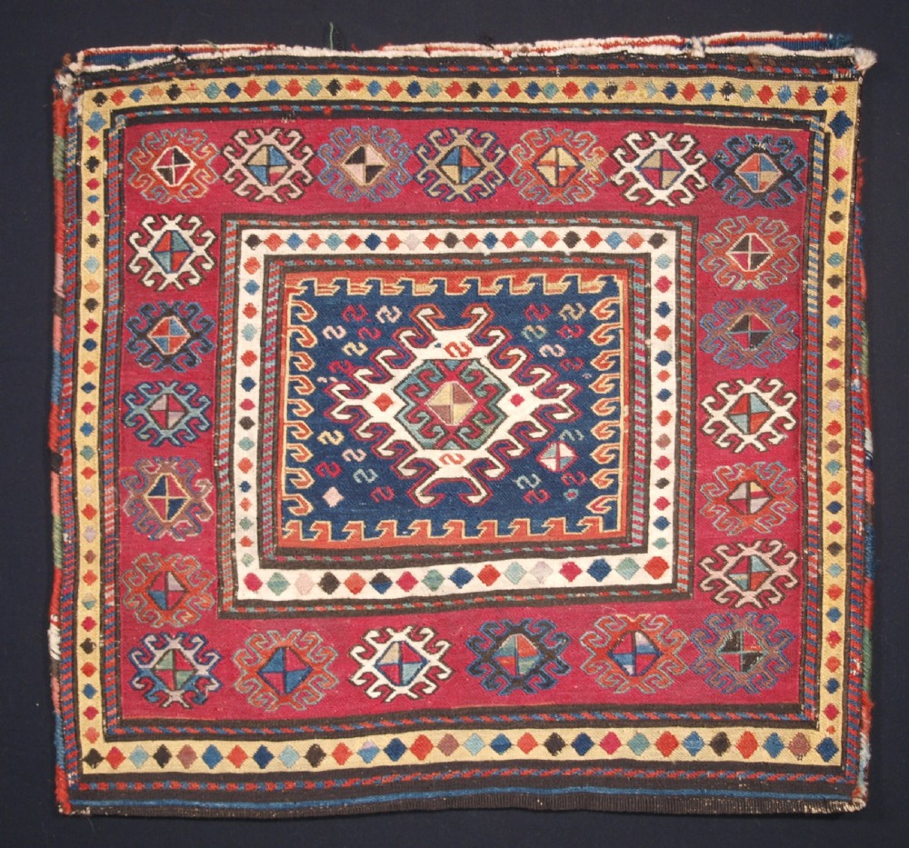 ANTIQUE SOUTH CAUCASIAN KHORJIN SADDLEBAG IN SOUMAK WEAVE, CIRCA 1900. B