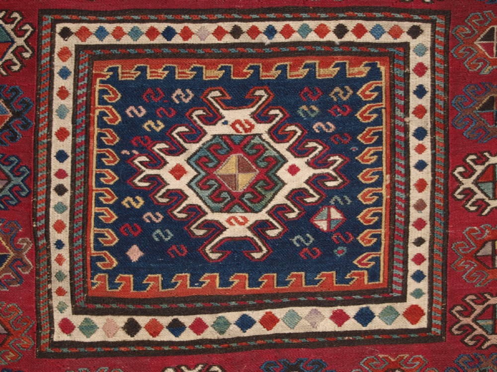 ANTIQUE SOUTH CAUCASIAN KHORJIN SADDLEBAG IN SOUMAK WEAVE, CIRCA 1900. B View III