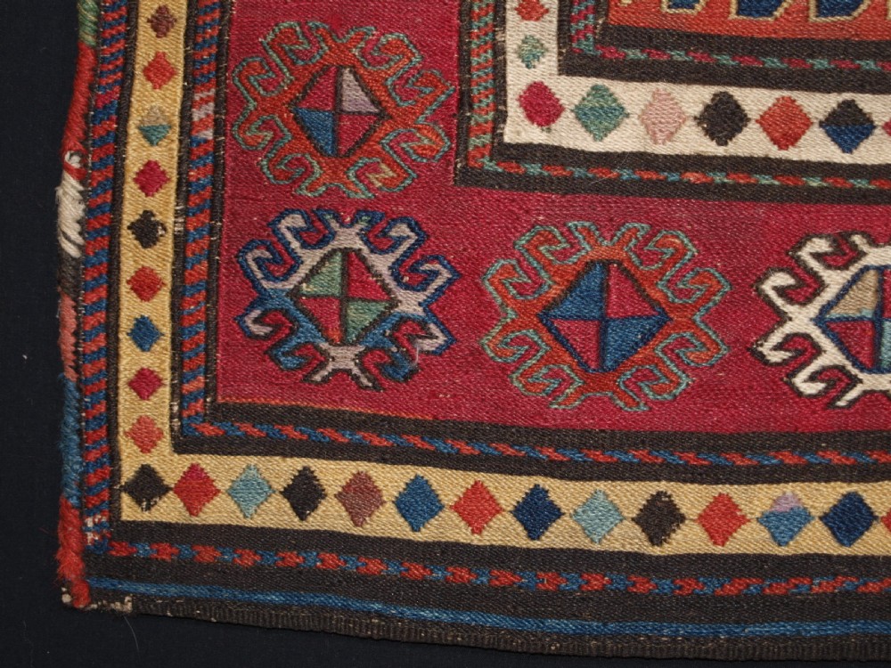 ANTIQUE SOUTH CAUCASIAN KHORJIN SADDLEBAG IN SOUMAK WEAVE, CIRCA 1900. B View V