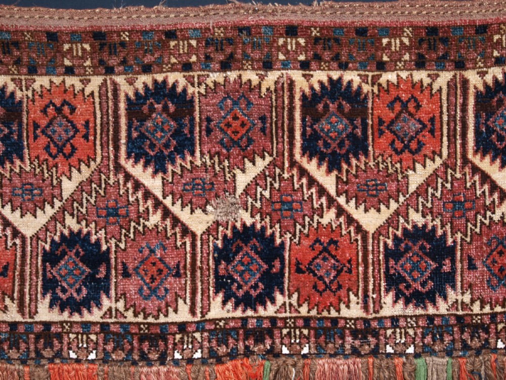 ANTIQUE ERSARI TURKMEN TORBA WITH UNUSUAL DESIGN, IVORY GROUND, CIRCA 1900. View V