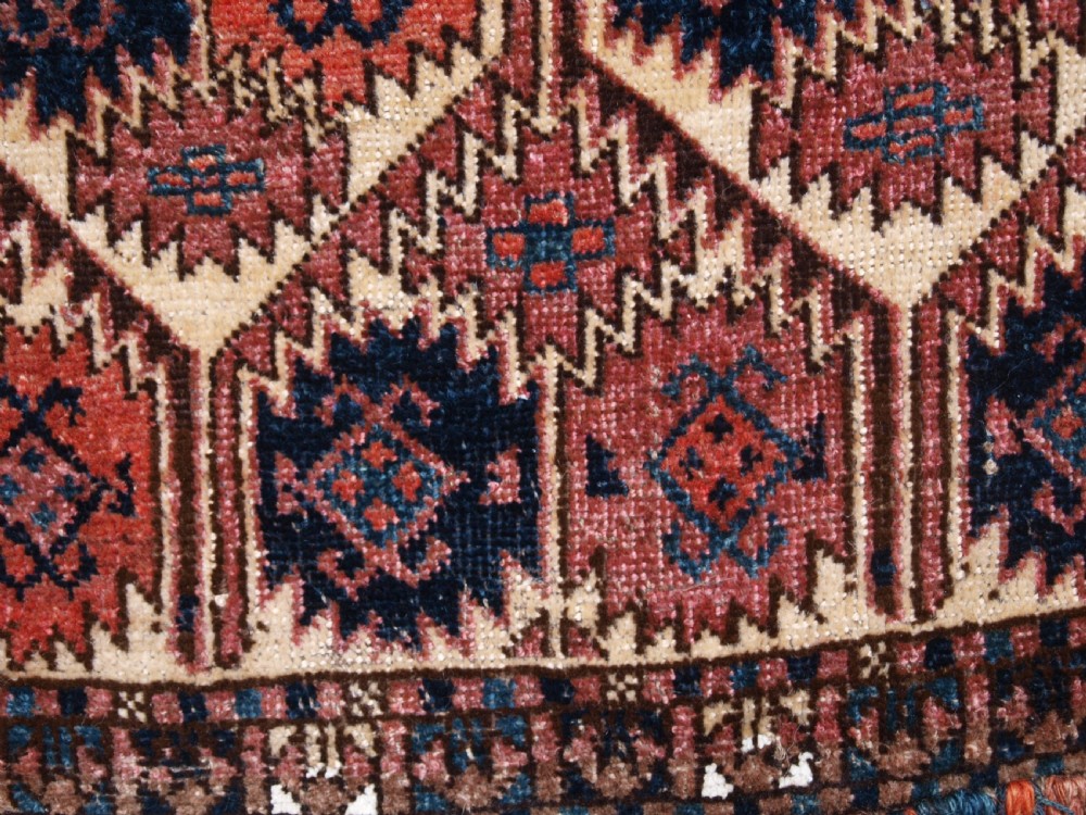 ANTIQUE ERSARI TURKMEN TORBA WITH UNUSUAL DESIGN, IVORY GROUND, CIRCA 1900. View VIII