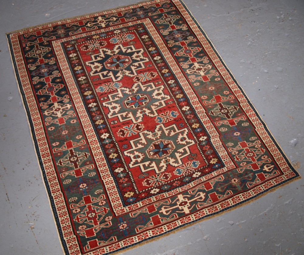 ANTIQUE EAST CAUCASIAN RUG WITH LESGHI STAR DESIGN, CIRCA 1890. View II