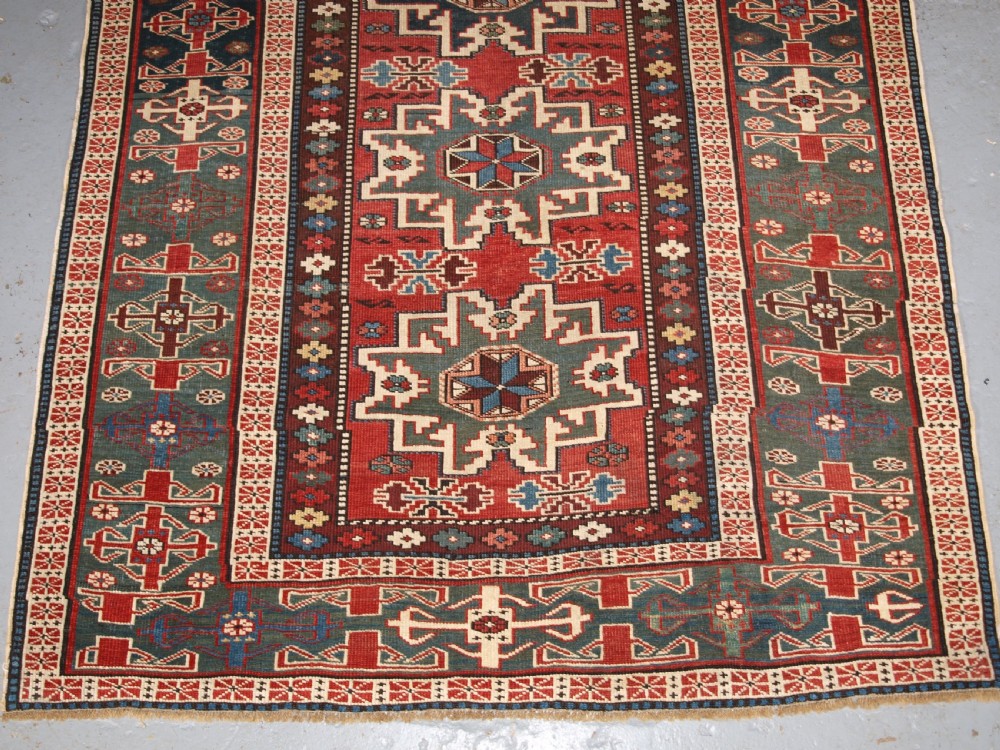 ANTIQUE EAST CAUCASIAN RUG WITH LESGHI STAR DESIGN, CIRCA 1890. View IV