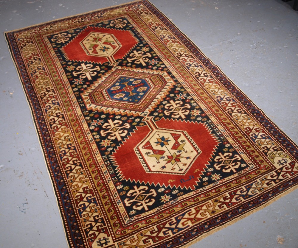 ANTIQUE CAUCASIAN RUG, SHIRVAN MEDALLION DESIGN, CIRCA 1890.